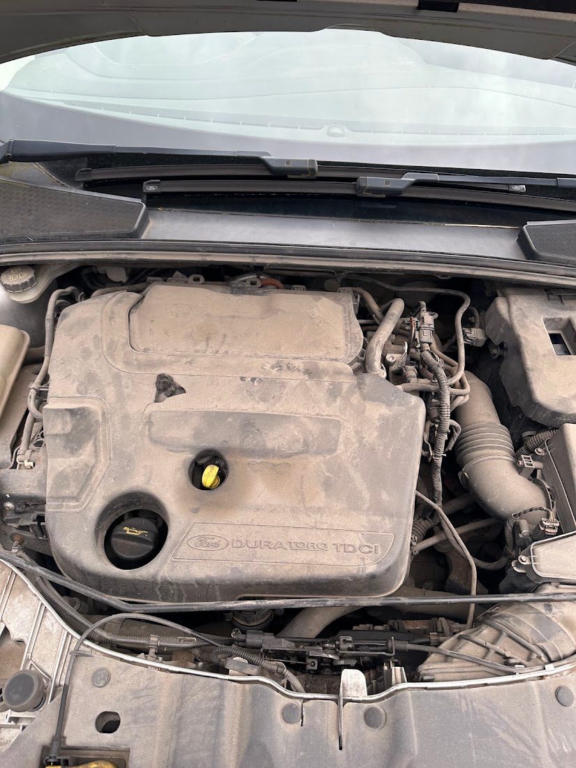 Dusty engine bay before cleaning
