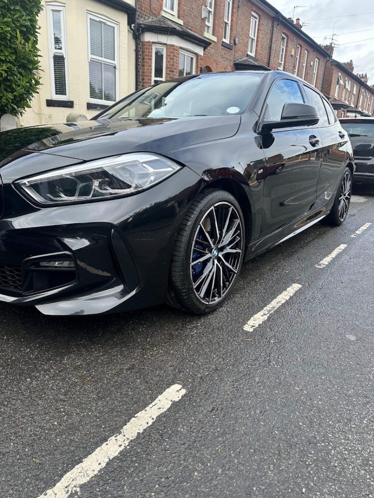 Black BMW 1 Series gleaming after a mobile detail by Detail Valets