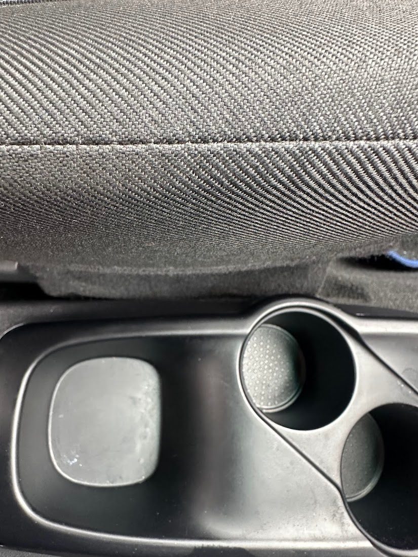 The same cup holders and console cleaned after an interior deep clean