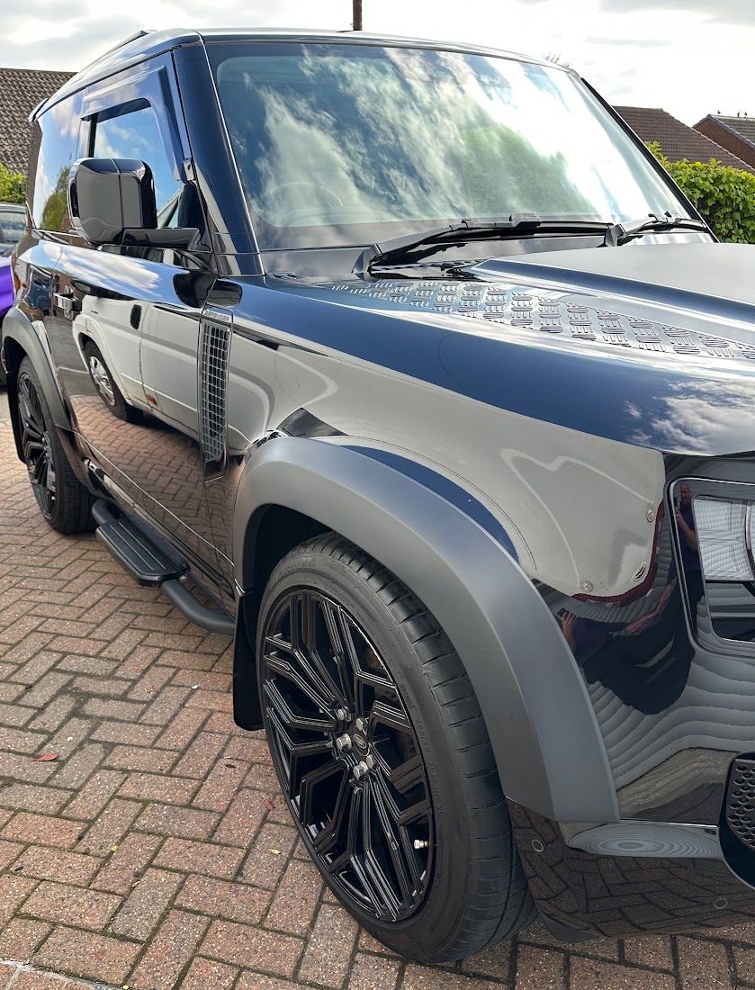 Black Land Rover Defender with a deep gloss finish after a machine polish in Rochdale