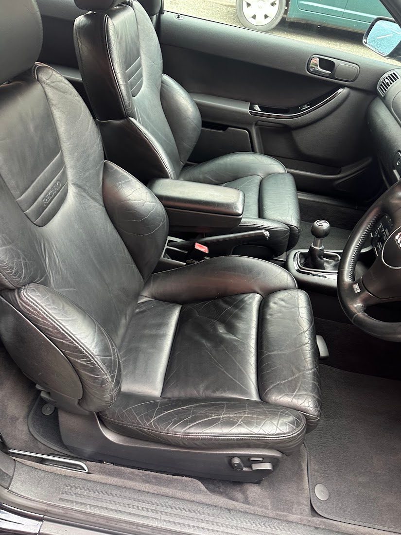 Black Recaro leather front seats of an older Audi A3 after a Deep Clean in Stockport